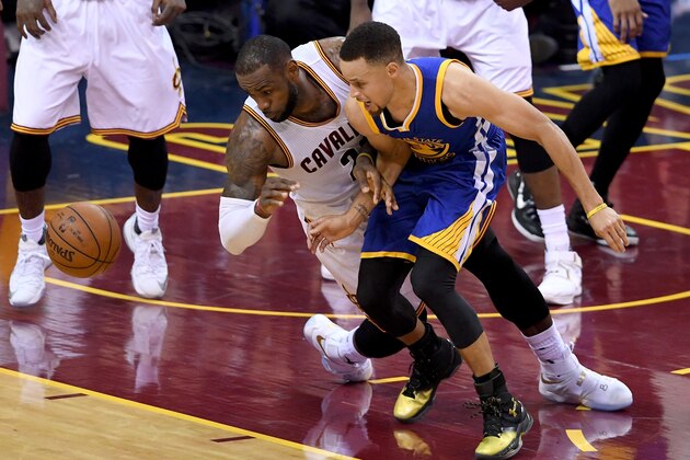 CLEVELAND, OH - JUNE 16:  LeBron James #23 of the Cleveland Cavaliers goes after the ball against Stephen Curry #30 of the Golden State Warriors in Game 6 of the 2016 NBA Finals at Quicken Loans Arena on June 16, 2016 in Cleveland, Ohio. NOTE TO USER: User expressly acknowledges and agrees that, by downloading and or using this photograph, User is consenting to the terms and conditions of the Getty Images License Agreement.  (Photo by Jason Miller/Getty Images)