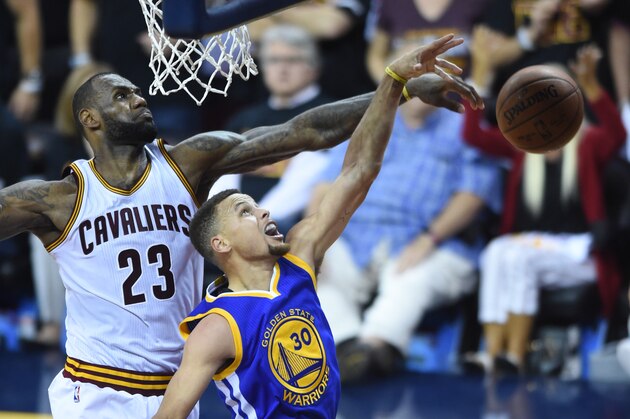 Jun 16, 2016; Cleveland, OH, USA; Cleveland Cavaliers forward LeBron James (23) blocks the shot by Golden State Warriors guard Stephen Curry (30) during the fourth quarter in game six of the NBA Finals at Quicken Loans Arena. Mandatory Credit: Ken Blaze-USA TODAY Sports