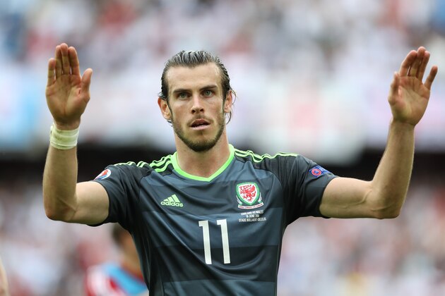 LENS, FRANCE - JUNE 16:  Gareth Bale of Wales gestures to the fans at full time during the UEFA EURO 2016 Group B match between England v Wales at Stade Bollaert-Delelis on June 16, 2016 in Lens, France. (Photo by Ian MacNicol/Getty Images)
