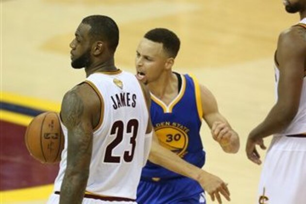 Golden State Warriors guard Stephen Curry reacts to being called for his sixth foul on Cleveland Cavaliers forward LeBron James (23) during the second half of Game 6 of basketball's NBA Finals in Cleveland, Thursday, June 16, 2016. (AP Photo/Ron Schwane)