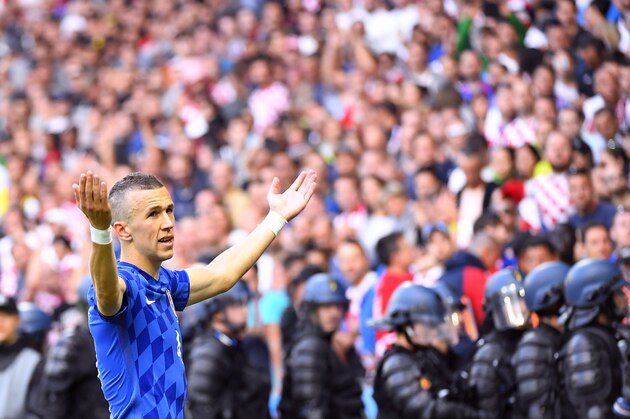 Croatia's midfielder Ivan Perisic reacts as flares are thrown onto the pitch during the Euro 2016 group D football match between Czech Republic and Croatia at the Geoffroy-Guichard stadium in Saint-Etienne on June 17, 2016.
Czech Republic and Croatia drew 2-2. / AFP / JEAN-PHILIPPE KSIAZEK        (Photo credit should read JEAN-PHILIPPE KSIAZEK/AFP/Getty Images)