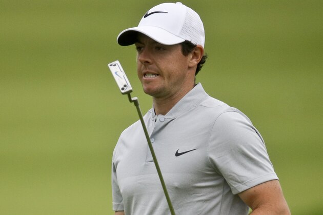 Rory McIlroy, of Northern Ireland, reacts to his putt on the 18th hole during the rain delayed first round of the U.S. Open golf championship at Oakmont Country Club on Friday, June 17, 2016, in Oakmont, Pa. (AP Photo/John Minchillo)