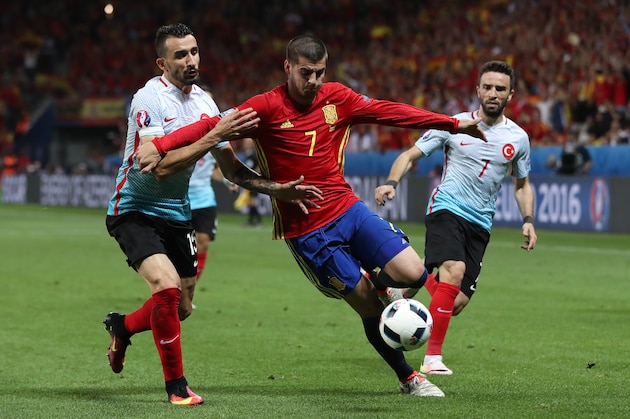 NICE, FRANCE - JUNE 17:  Mehmet Topal of Turkey vies with Alvaro Morata of Spain during the UEFA EURO 2016 Group D match between Spain and Turkey at Allianz Riviera Stadium on June 17, 2016 in Nice, France. (Photo by Ian MacNicol/Getty Images)