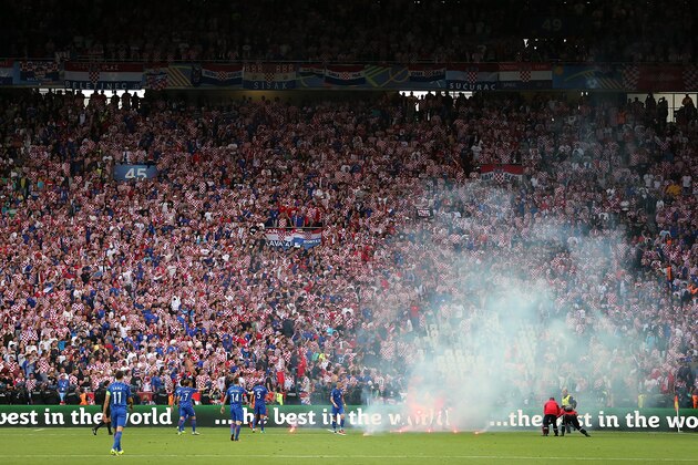 SAINT-ETIENNE, FRANCE - JUNE 17:  Flares are thrown on to the pitch during the UEFA EURO 2016 Group D match between Czech Republic and Croatia at Stade Geoffroy-Guichard on June 17, 2016 in Saint-Etienne, France.  (Photo by James Baylis - AMA/Getty Images)