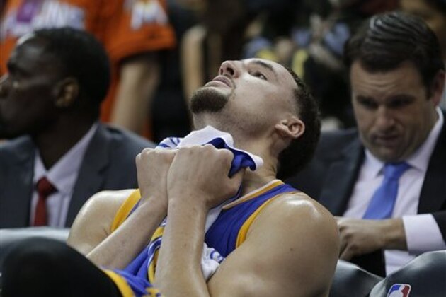 Golden State Warriors guard Klay Thompson reacts on the bench against the Cleveland Cavaliers during the second half of Game 6 of basketball's NBA Finals in Cleveland, Thursday, June 16, 2016. Cleveland won 115-101. (AP Photo/Tony Dejak)