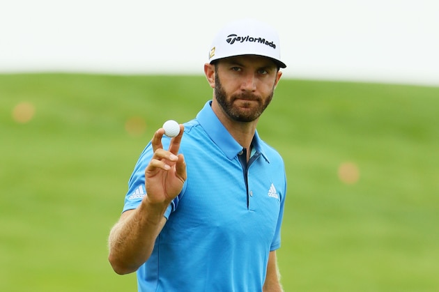 OAKMONT, PA - JUNE 17:  Dustin Johnson of the United States waves to the gallery on the first green during the continuation of the weather delayed first round of the U.S. Open at Oakmont Country Club on June 17, 2016 in Oakmont, Pennsylvania.  (Photo by Andrew Redington/Getty Images)