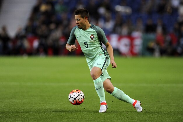 In this Sunday, May 29, 2016 photo, Portugal's Raphael Guerreiro runs with the ball during a friendly soccer match between Portugal and Norway at the Dragao stadium in Porto, Portugal. (AP Photo/Paulo Duarte)