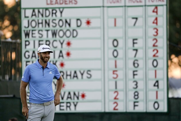 Dustin Johnson smiles on the ninth green during the rain delayed second round of the U.S. Open golf championship at Oakmont Country Club on Friday, June 17, 2016, in Oakmont, Pa. (AP Photo/Charlie Riedel)