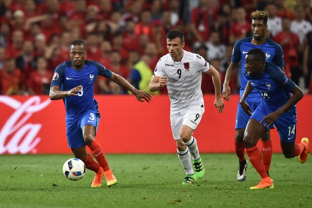 France's defender Patrice Evra (L) and France's midfielder Blaise Matuidi (R) vie for the ball with Albania's midfielder Ledian Memushaj (C) during the Euro 2016 group A football match between France and Albania at the Velodrome stadium in Marseille on June 15, 2016. / AFP / BERTRAND LANGLOIS        (Photo credit should read BERTRAND LANGLOIS/AFP/Getty Images)