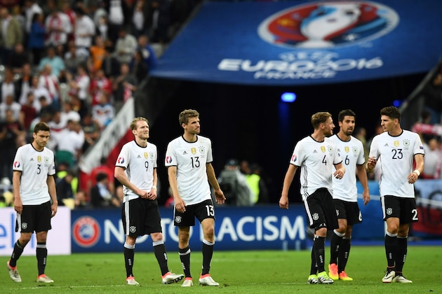 From left: Germany's defender Jonas Hector, Germany's forward Andre Schuerrle, Germany's midfielder Thomas Mueller, Germany's defender Benedikt Hoewedes, Germany's midfielder Sami Khedira and Germany's forward Mario Gomez walk off the pitch following their 0-0 draw in the Euro 2016 group C football match between Germany and Poland at the Stade de France stadium in Saint-Denis near Paris on June 16, 2016. / AFP / FRANCK FIFE        (Photo credit should read FRANCK FIFE/AFP/Getty Images)