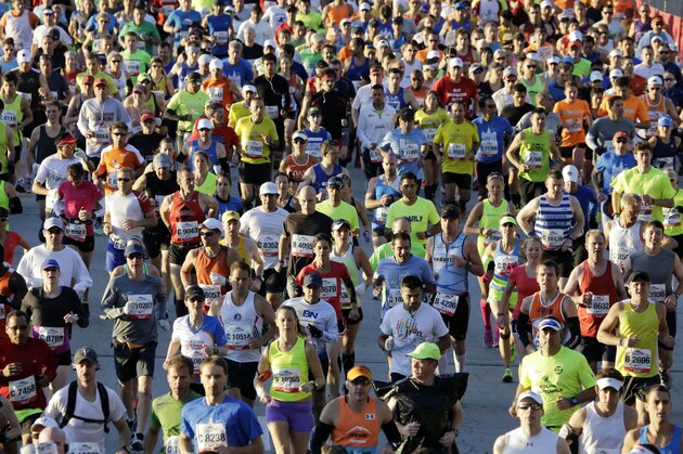 Runners participate in the Chicago Marathon in Chicago, Sunday, Oct. 13, 2013.  (AP Photo/Nam Y. Huh)