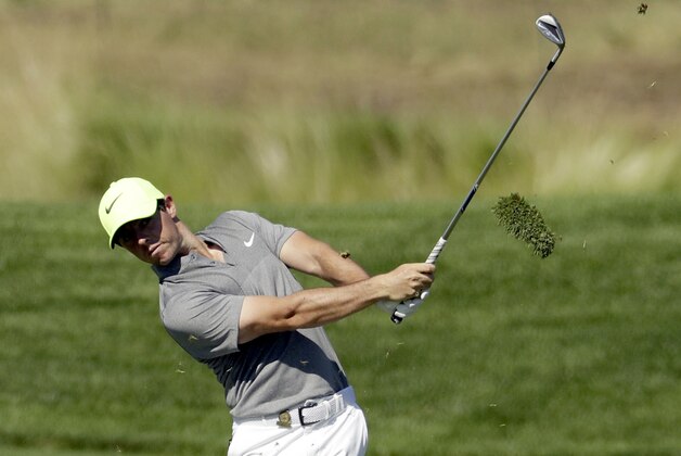 Rory McIlroy, of Northern Ireland, hits from the fairway on the 12th hole during the rain delayed second round of the U.S. Open golf championship at Oakmont Country Club on Saturday, June 18, 2016, in Oakmont, Pa. (AP Photo/Charlie Riedel)