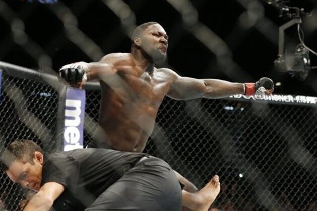 Anthony Johnson celebrates after defeating Jimi Manuwa during their light heavyweight mixed martial arts bout at UFC 191 on Saturday, Sept. 5, 2015, in Las Vegas. (AP Photo/John Locher)