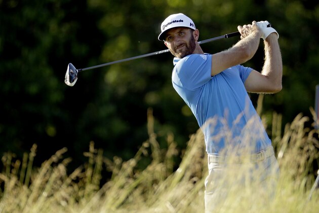 Dustin Johnson watches his tee shot on the fourth hole during the rain delayed second round of the U.S. Open golf championship at Oakmont Country Club on Friday, June 17, 2016, in Oakmont, Pa. (AP Photo/Charlie Riedel)