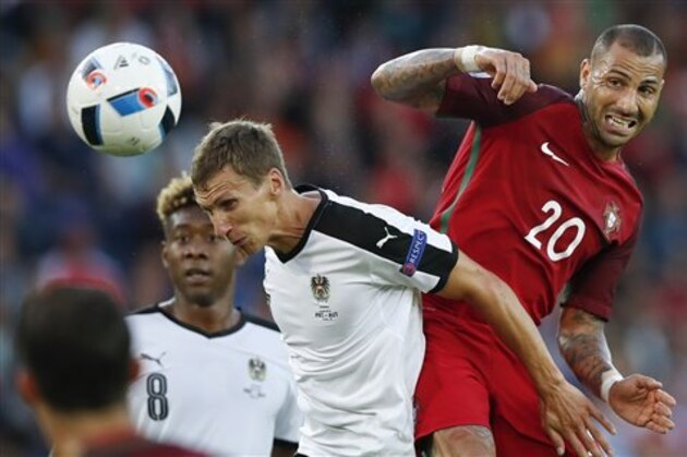 Portugal's Ricardo Quaresma, right, and Austria's Florian Klein go for the ball during the Euro 2016 Group F soccer match between Portugal and Austria at the Parc des Princes stadium in Paris, France, Saturday, June 18, 2016. (AP Photo/Christophe Ena)
