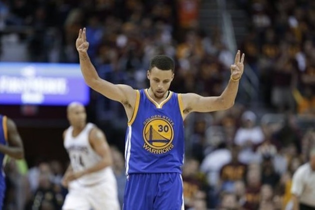 Golden State Warriors guard Stephen Curry (30) celebrates a basket against the Cleveland Cavaliers during the second half of Game 4 of basketball's NBA Finals in Cleveland, Friday, June 10, 2016. (AP Photo/Tony Dejak)