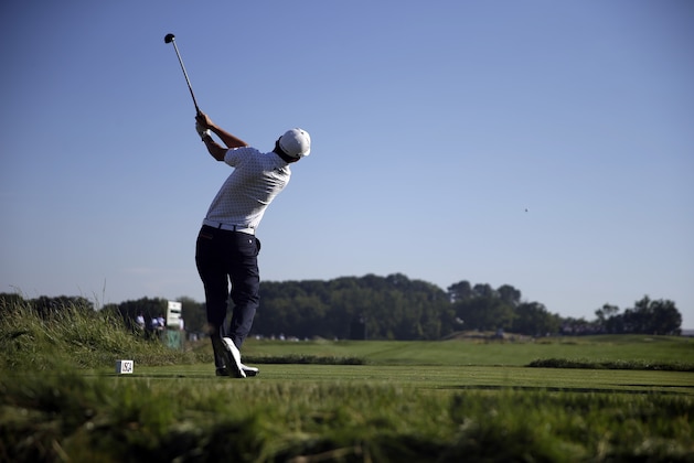 Andrew Landry watches his tee shot  on the fifth hole during the rain delayed second round of the U.S. Open golf championship at Oakmont Country Club on Saturday, June 18, 2016, in Oakmont, Pa. (AP Photo/John Minchillo)