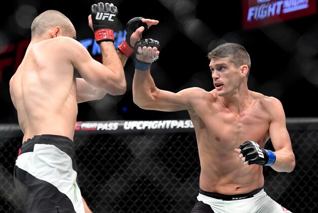 Jun 18, 2016; Ottawa, Ontario, Canada; Stephen Thompson (blue gloves) fights Rory MacDonald (red gloves) during UFC Fight Night at TD Place Arena. Mandatory Credit: Marc DesRosiers-USA TODAY Sports