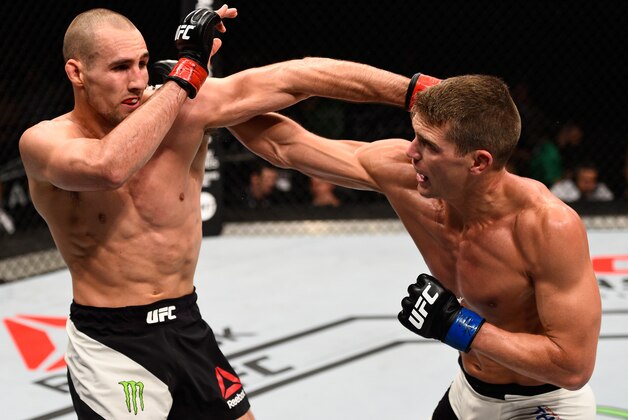 OTTAWA, ON - JUNE 18:   (R-L) Stephen Thompson of the United States punches Rory MacDonald of Canada in their welterweight bout during the UFC Fight Night event inside the TD Place Arena on June 18, 2016 in Ottawa, Ontario, Canada. (Photo by Jeff Bottari/Zuffa LLC/Zuffa LLC via Getty Images)