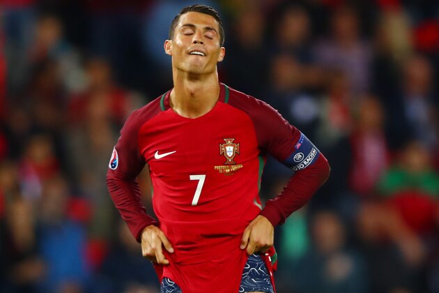 PARIS, FRANCE - JUNE 18:  Cristiano Ronaldo of Portugal reacts after missing a penalty during the UEFA EURO 2016 Group F match between Portugal and Austria at Parc des Princes on June 18, 2016 in Paris, France.  (Photo by Clive Rose/Getty Images)