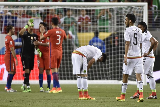 Chilean players (L) celebrate as Mexican players react in dejection after the Copa America Centenario quarterfinal football match in Santa Clara, California, United States, on June 18, 2016. 
Chile defeated Mexico by 7-0 and qualified for semi-finals. / AFP / OMAR TORRES        (Photo credit should read OMAR TORRES/AFP/Getty Images)