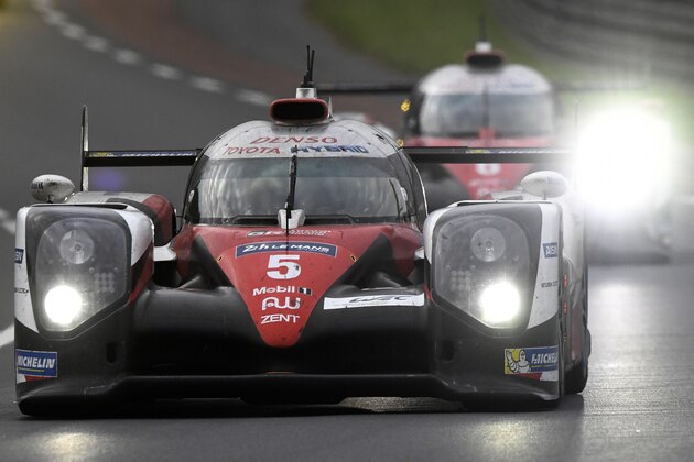 Switzerland's Sebastien Buemi drives his Toyota TSO50  Hybrid N°5 ahead of France's Stephane Sarrazin on his Toyota TSO50  Hybrid N°6 in the lead of the race, during the 84th Le Mans 24-hours endurance race, on June 19, 2016 in Le Mans, western France. / AFP / JEAN-FRANCOIS MONIER        (Photo credit should read JEAN-FRANCOIS MONIER/AFP/Getty Images)