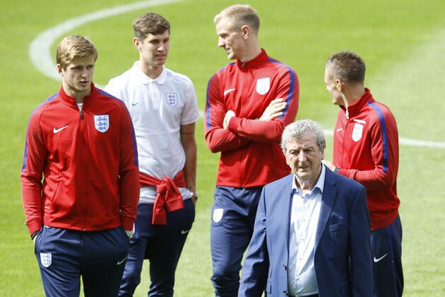 England manager Roy Hodgson, front, with players during a pitch walkabout session at the Bollaert stadium in Lens, France, Wednesday, June 15, 2016. England will face Wales in a Euro 2016 Group B soccer match in Lens on Thursday, June 16. (AP Photo/Kirsty Wigglesworth)