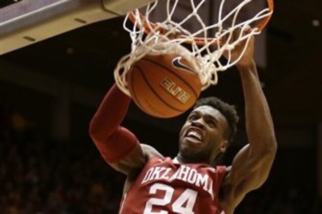 FILE - In this Jan. 18, 2016, file photo, Oklahoma guard Buddy Hield (24) dunks the ball during the first half of a college basketball game against Iowa State in Ames, Iowa. Buddy Hield had big expectations when he returned to Oklahoma for his senior season. Things have gone even better than expected. The sharpshooting guard has averaged 29.3 points in the NCAA Tournament heading into the Sooners’ national semifinal Saturday against Villanova. (AP Photo/Charlie Neibergall, File)
