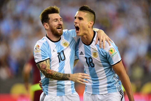 Argentina's Erik Lamela (R) celebrates with teammate Lionel Messi after scoring against Venezuela during a Copa America Centenario quarterfinal football match in Foxborough, Massachusetts, United States, on June 18, 2016.  / AFP / ALFREDO ESTRELLA        (Photo credit should read ALFREDO ESTRELLA/AFP/Getty Images)