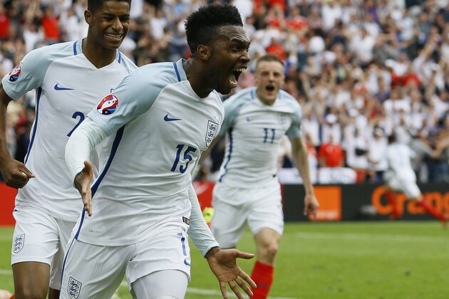 England's Daniel Sturridge, front, celebrates after scoring his side’s second goal during the Euro 2016 Group B soccer match between England and Wales at the Bollaert stadium in Lens, France, Thursday, June 16, 2016. Behind are Marcus Rashford, left, and Jamie Vardy. (AP Photo/Kirsty Wigglesworth)