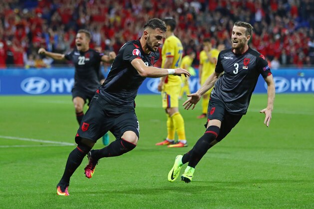 LYON, FRANCE - JUNE 19:  Armando Sadiku (L) of Albania celebrates scoring his team's first goal with his team mate Ermir Lenjani (R) during the UEFA EURO 2016 Group A match between Romania and Albania at Stade des Lumieres on June 19, 2016 in Lyon, France.  (Photo by Michael Steele/Getty Images)