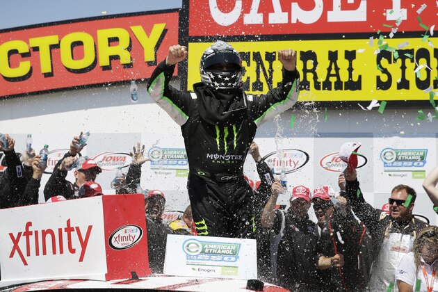 Sam Hornish Jr., center, celebrates in Victory Lane after winning the NASCAR Xfinity Series auto race, Sunday, June 19, 2016, at Iowa Speedway in Newton, Iowa. (AP Photo/Charlie Neibergall)