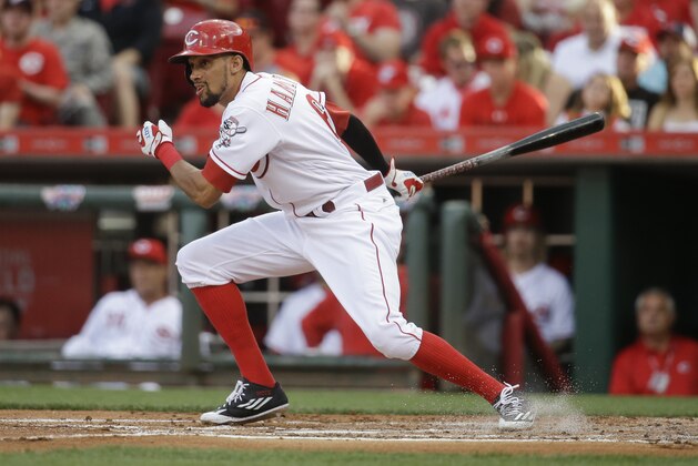 Cincinnati Reds' Billy Hamilton hits a single off St. Louis Cardinals starting pitcher Mike Leake in the second inning of a baseball game, Tuesday, June 7, 2016, in Cincinnati. The Reds won 7-6. (AP Photo/John Minchillo)