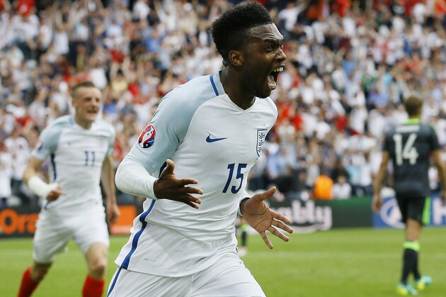 England's Daniel Sturridge celebrates after scoring his side's second goal during the Euro 2016 Group B soccer match between England and Wales at the Bollaert stadium in Lens, France, Thursday, June 16, 2016.  Behind is teammate Jamie Vardy. (AP Photo/Kirsty Wigglesworth)