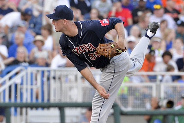 Arizona starting pitcher Nathan Bannister delivers against Miami in the second inning of an NCAA men's College World Series baseball game in Omaha, Neb., Saturday, June 18, 2016. (AP Photo/Mike Theiler)