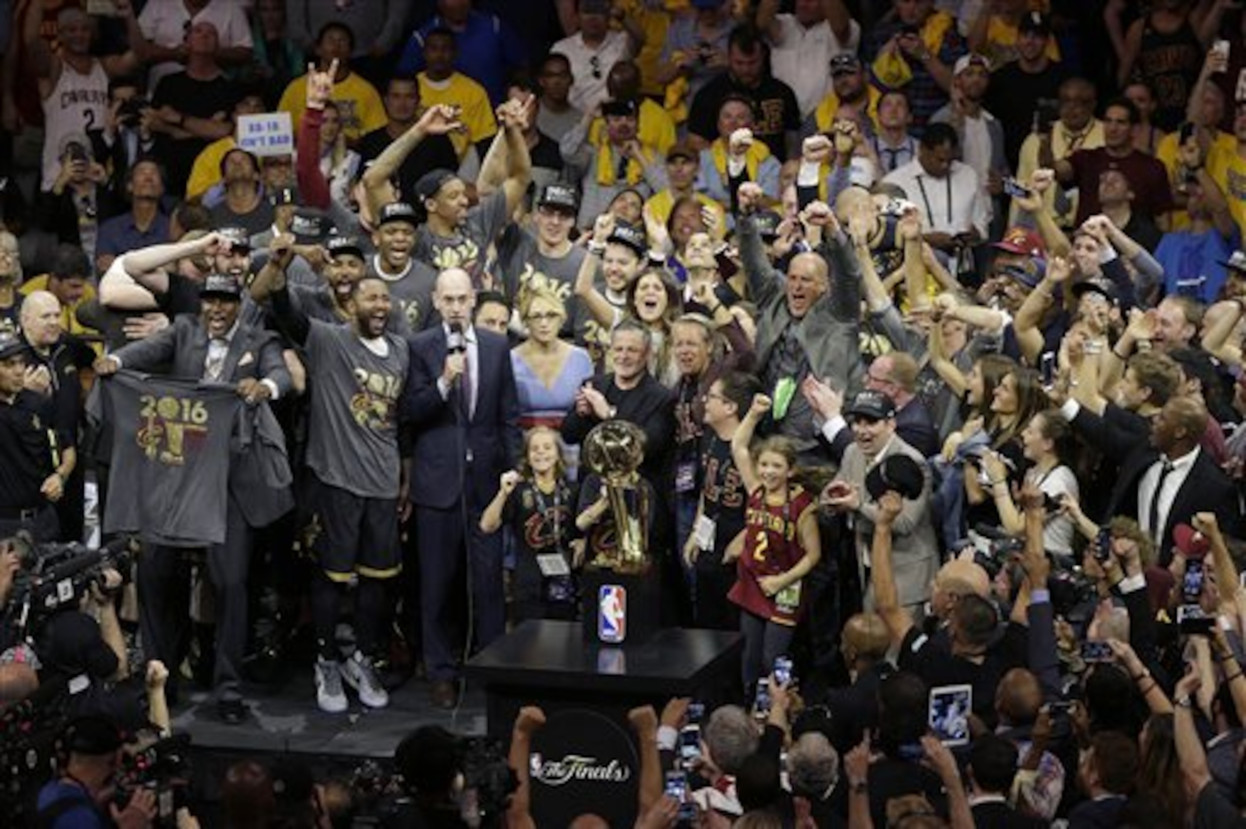 Cleveland Cavaliers players and staff celebrate after Game 7 of basketball's NBA Finals between the Golden State Warriors and the Cavaliers in Oakland, Calif., Sunday, June 19, 2016. The Cavaliers won 93-89. (AP Photo/Eric Risberg)
