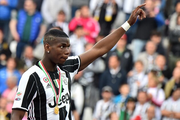 Juventus' midfielder Paul Pogba from France celebrates after the Italian Serie A football match Juventus vs Sampdoria on May 14, 2016 at the 'Juventus Stadium' in Turin. / AFP / GIUSEPPE CACACE        (Photo credit should read GIUSEPPE CACACE/AFP/Getty Images)