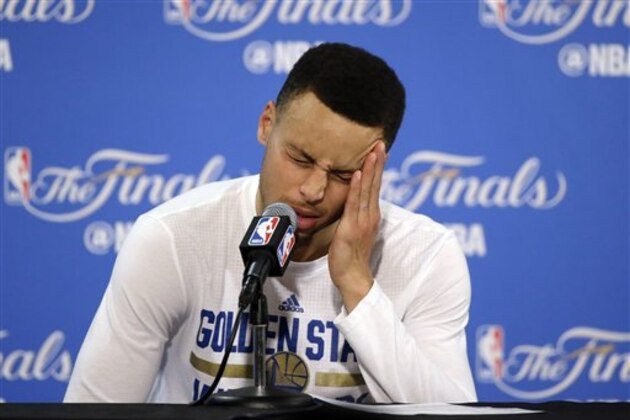 Golden State Warriors' Stephen Curry answers questions during a post-game press conference after Game 7 of basketball's NBA Finals Sunday, June 19, 2016, in Oakland, Calif. Cleveland won 93-89. (AP Photo/Eric Risberg)
