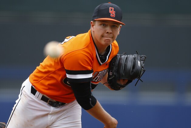 Oklahoma State's Tyler Buffett pitches in the second inning of the championship game against Texas of the NCAA college Big 12 conference baseball tournament in Tulsa, Okla., Sunday, May 24, 2015. Texas won 6-3. (AP Photo/Sue Ogrocki)