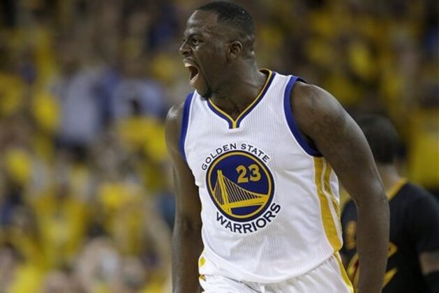 Golden State Warriors forward Draymond Green reacts after scoring against the Cleveland Cavaliers during the second half of Game 7 of basketball's NBA Finals in Oakland, Calif., Sunday, June 19, 2016. (AP Photo/Marcio Jose Sanchez)