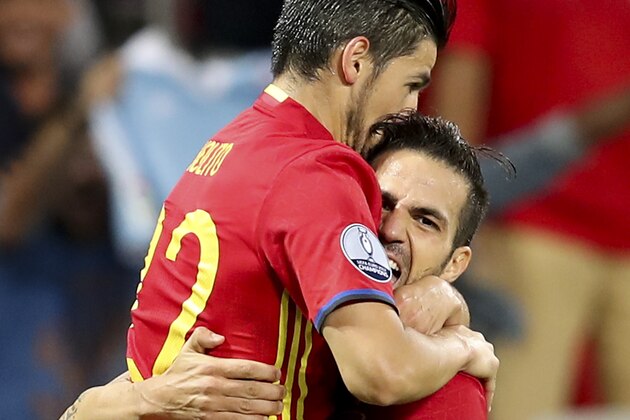 Spain's Nolito, left, celebrates with his teammate Cesc Fabregas after scoring his side's second goal during the Euro 2016 Group D soccer match between Spain and Turkey at the Allianz Riviera stadium in Nice, France, Friday, June 17, 2016. (AP Photo/Claude Paris)