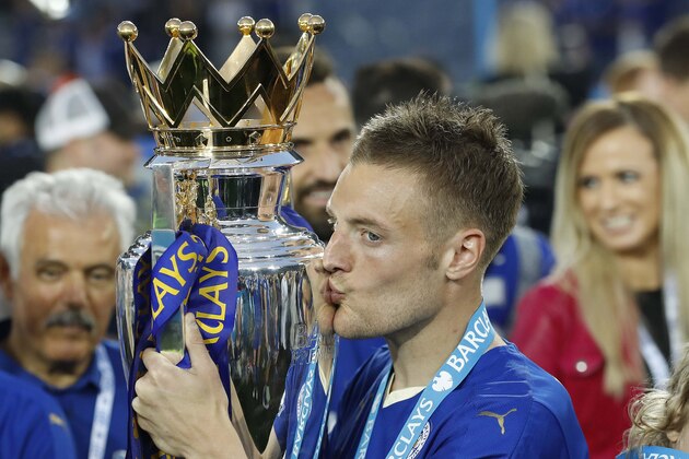 Leicester’s Jamie Vardy kisses the trophy as Leicester City celebrate becoming the English Premier League soccer champions at King Power stadium in Leicester, England, Saturday, May 7, 2016.(AP Photo/Matt Dunham)
