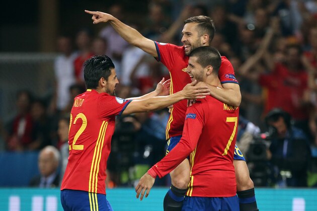 NICE, FRANCE - JUNE 17: Alvaro Morata of Spain celebrates his second goal with Jordi Alba and Nolito (left) during the UEFA EURO 2016 Group D match between Spain and Turkey at Allianz Riviera Stadium on June 17, 2016 in Nice, France. (Photo by Jean Catuffe/Getty Images)