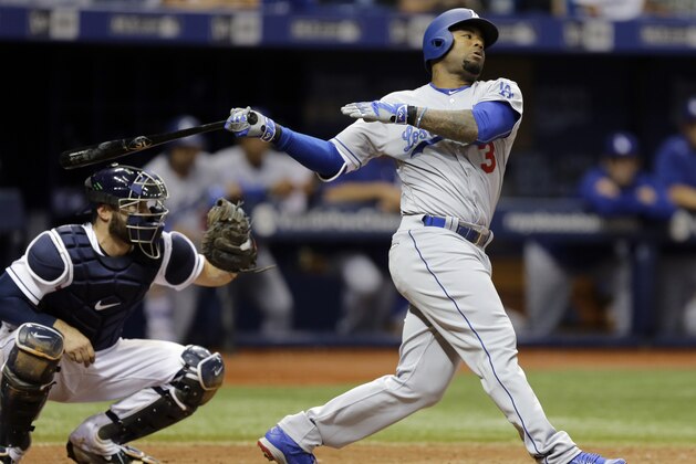 Los Angeles Dodgers' Carl Crawford strikes out against the Tampa Bay Rays during the eighth inning of an interleague baseball game Wednesday, May 4, 2016, in St. Petersburg, Fla. Catching for the Rays is Curt Casali. (AP Photo/Chris O'Meara)