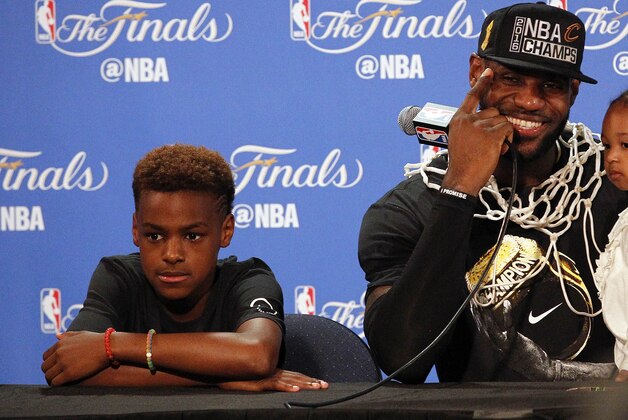 June 19, 2016; Oakland, CA, USA; Cleveland Cavaliers forward LeBron James (23) speaks to media with his children Lebron James Jr. and daughter Zhuri James following the 93-89 victory against the Golden State Warriors in game seven of the NBA Finals at Oracle Arena. Mandatory Credit: Cary Edmondson-USA TODAY Sports