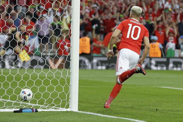 Wales's Aaron Ramsey celebrates scoring the opening goal during the Euro 2016 Group B soccer match between Russia and Wales at the Stadium municipal in Toulouse, France, Monday, June 20, 2016. (AP Photo/Thanassis Stavrakis)