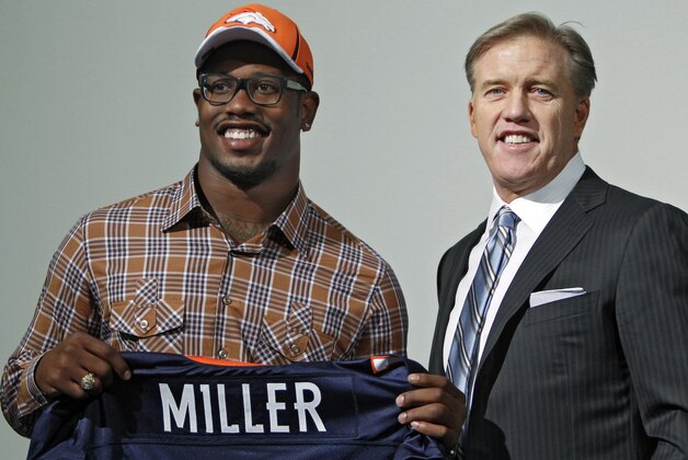 Denver Broncos' first round draft pick Texas A&M linebacker Von Miller poses with the Broncos' vice president John Elway during an introductory news conference at the football team's headquarters in Englewood, Colo., on Friday, April 29, 2011. (AP Photo/Ed Andrieski)