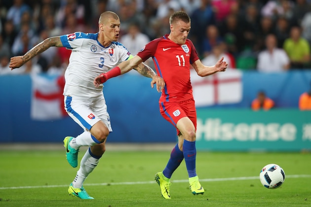 SAINT-ETIENNE, FRANCE - JUNE 20:  Jamie Vardy of England and Martin Skrtel of Slovakia compete for the ball during the UEFA EURO 2016 Group B match between Slovakia and England at Stade Geoffroy-Guichard on June 20, 2016 in Saint-Etienne, France.  (Photo by Clive Brunskill/Getty Images)