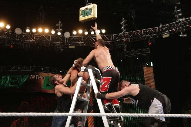 Everyone trying to grab the Money in the Bank briefcase.