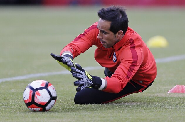 Chile goalkeeper Claudio Bravo makes a save during a Copa America Centenario soccer practice in Foxborough, Mass., Thursday, June 9, 2016. Chile faces Bolivia on Friday in a Group D match. (AP Photo/Charles Krupa)